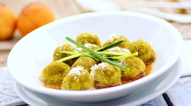 Canederli dumplings with peas and parsley