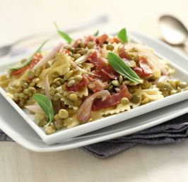 Bow-tie pasta with giant lentils, ham and sage