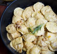Chickpea and baccalà ravioli with hazelnut butter, rosemary and lemon
