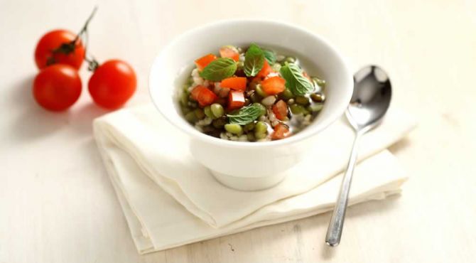 Light Soup with diced tomatoes marinated in mint